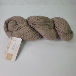 Skein of Blue Sky Alpacas Royal Limited Edition in a beige colorway, available to purchase with your gift card on Yarn Saver.