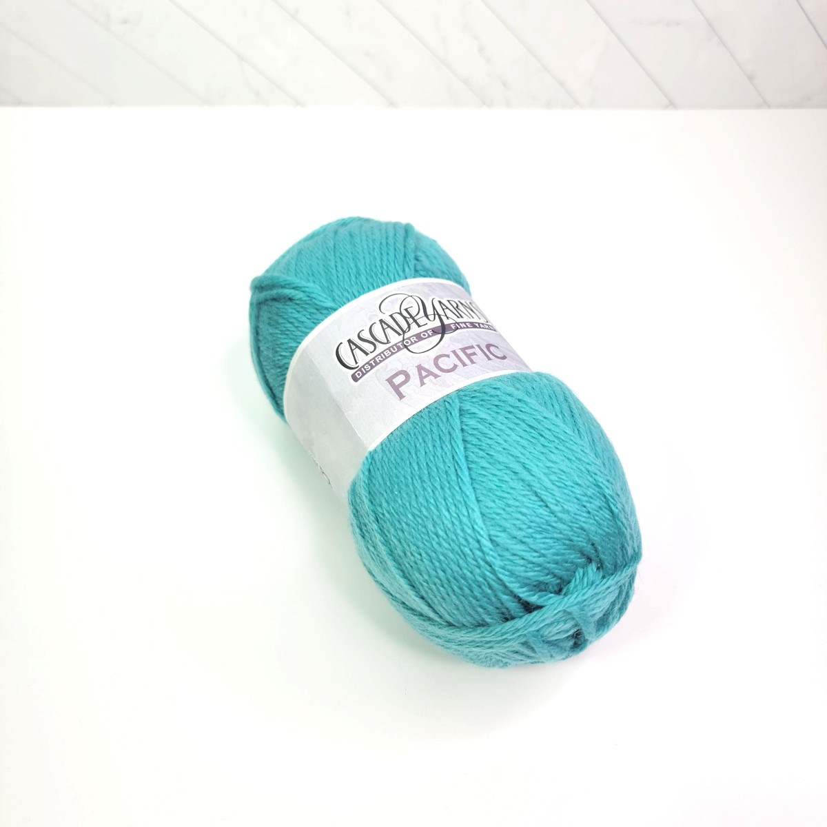 Cascade Yarns Pacific in 149 Blue Green - Image 1